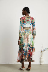 Éva pattern-print V-neck midi dress