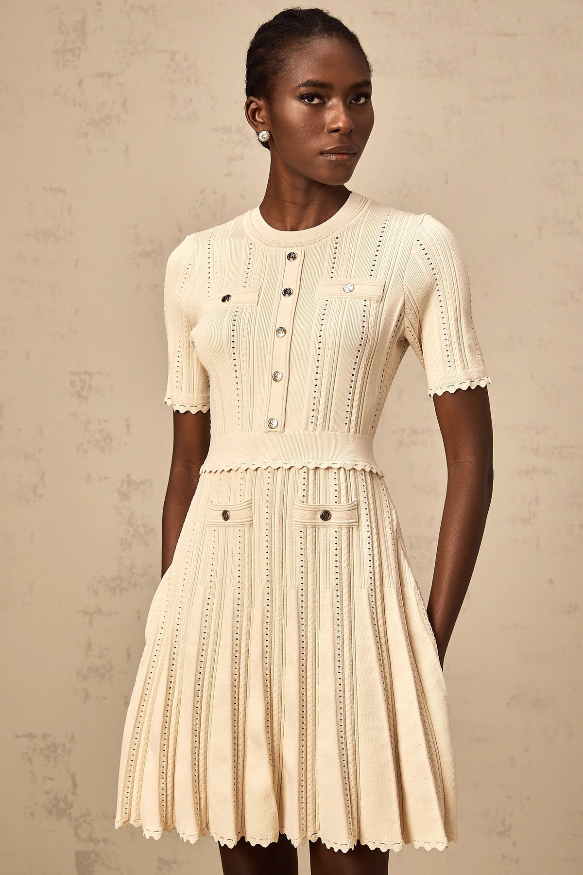 Amélie neutrals pointelle-trim pleated knit mini dress