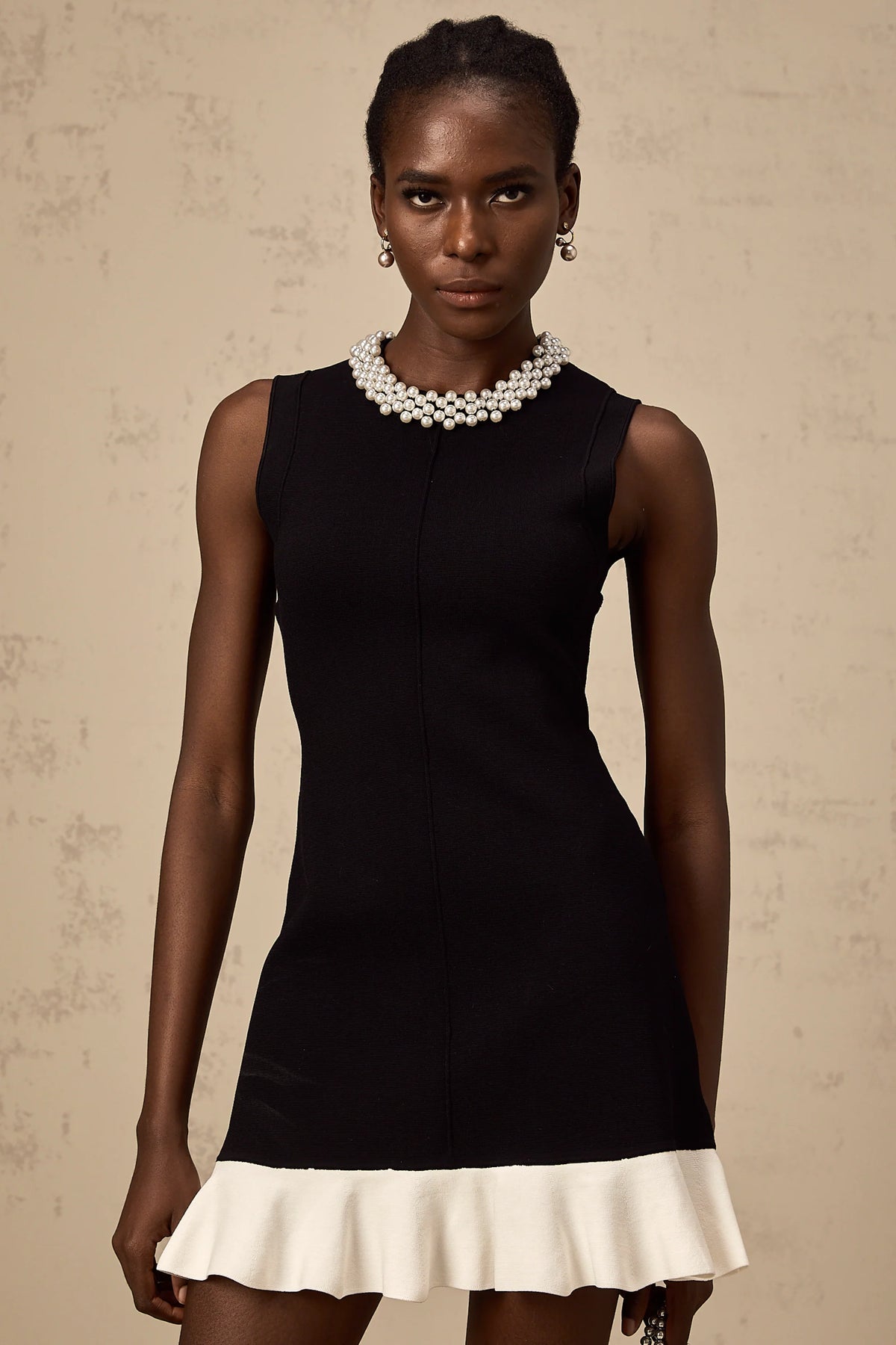 Elodie black faux-pearl ruffled knitted mini dress
